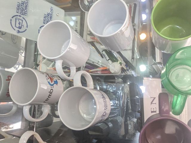 Printed promotional mugs on the display shelf